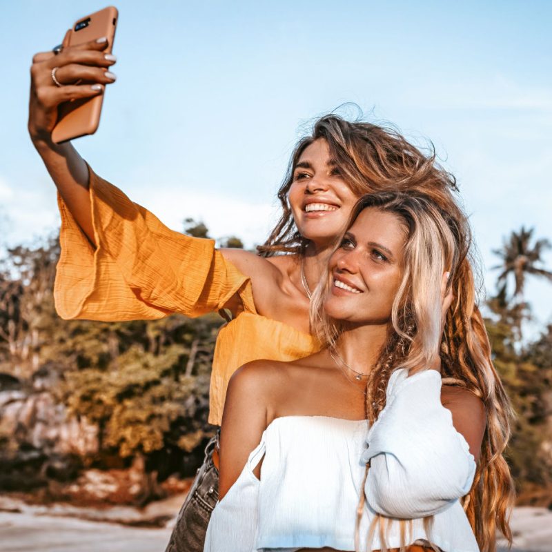 group of young adults smiling and laughing